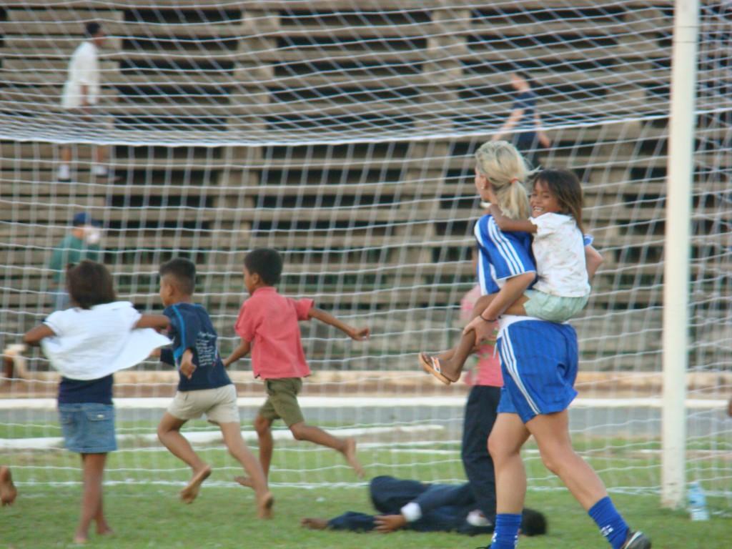 pic 8 Keri Michel with street kids in Phnom Penh after they scaled into the football stadium