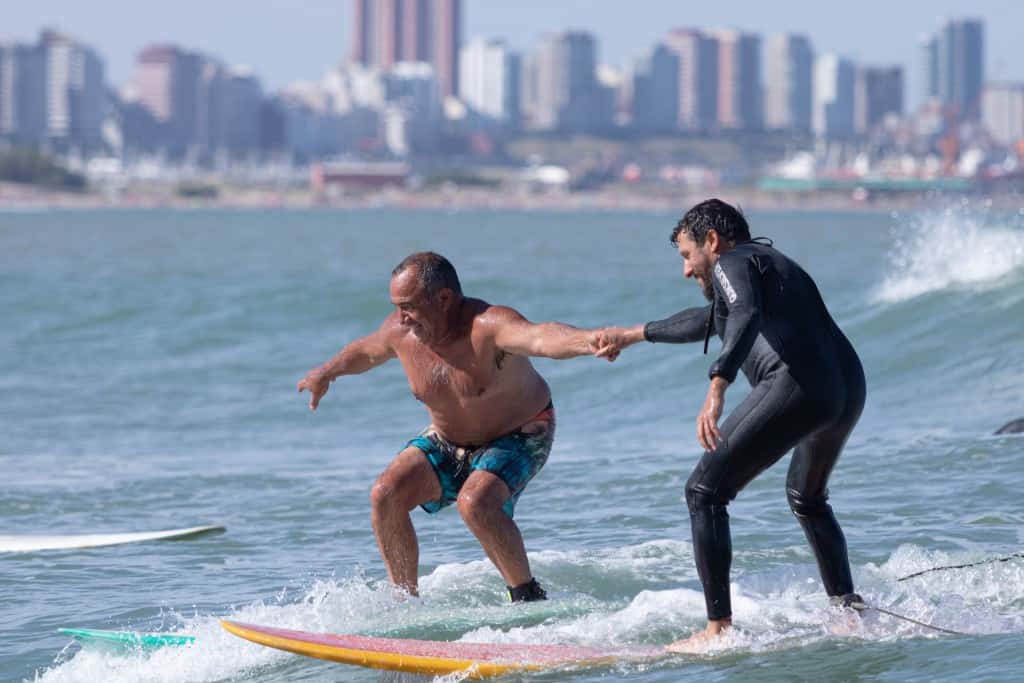 man Learning to surf Kim Wright battleface.com