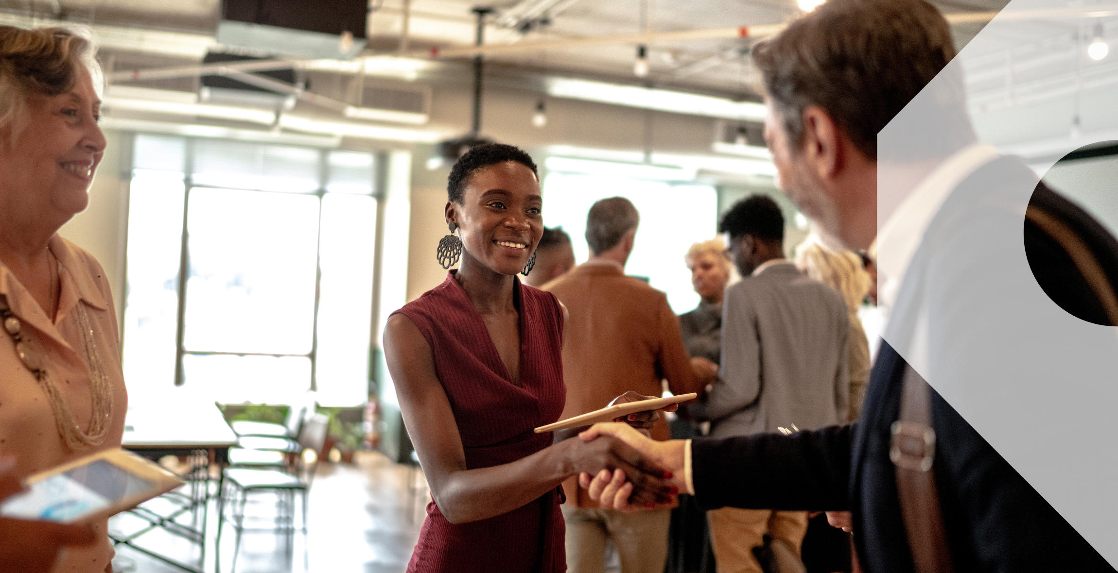 Two business travellers meeting at a work event.